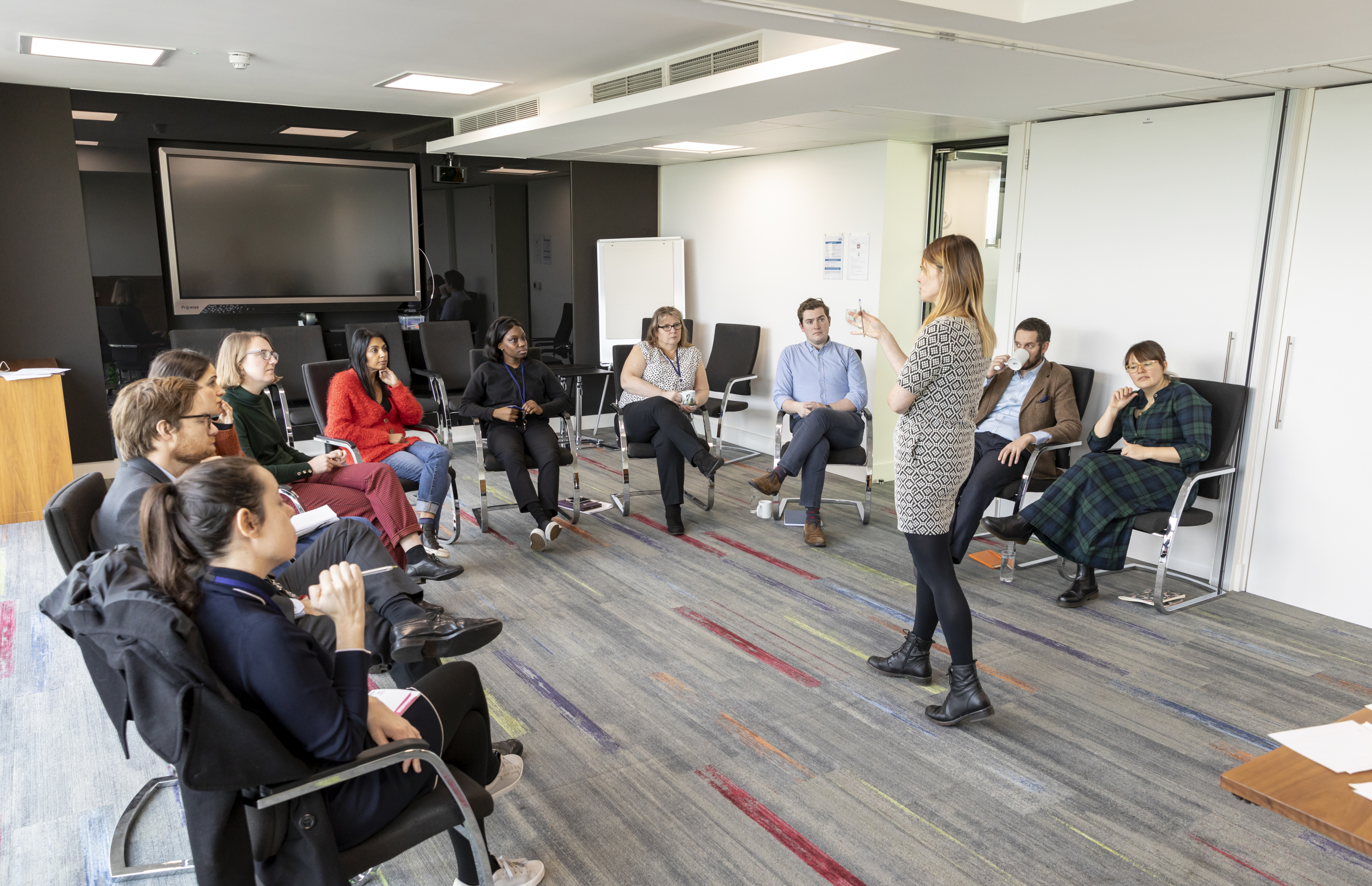 National Housing Federation – Disability Awareness Training Sess Jennie talking to a group of delegates facing them in a corporate environment
